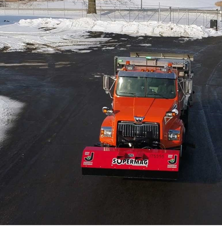 Storch Magnetic Sweeper on a Jackson County Michigan truck: Front mount Hastings Hitch assembly