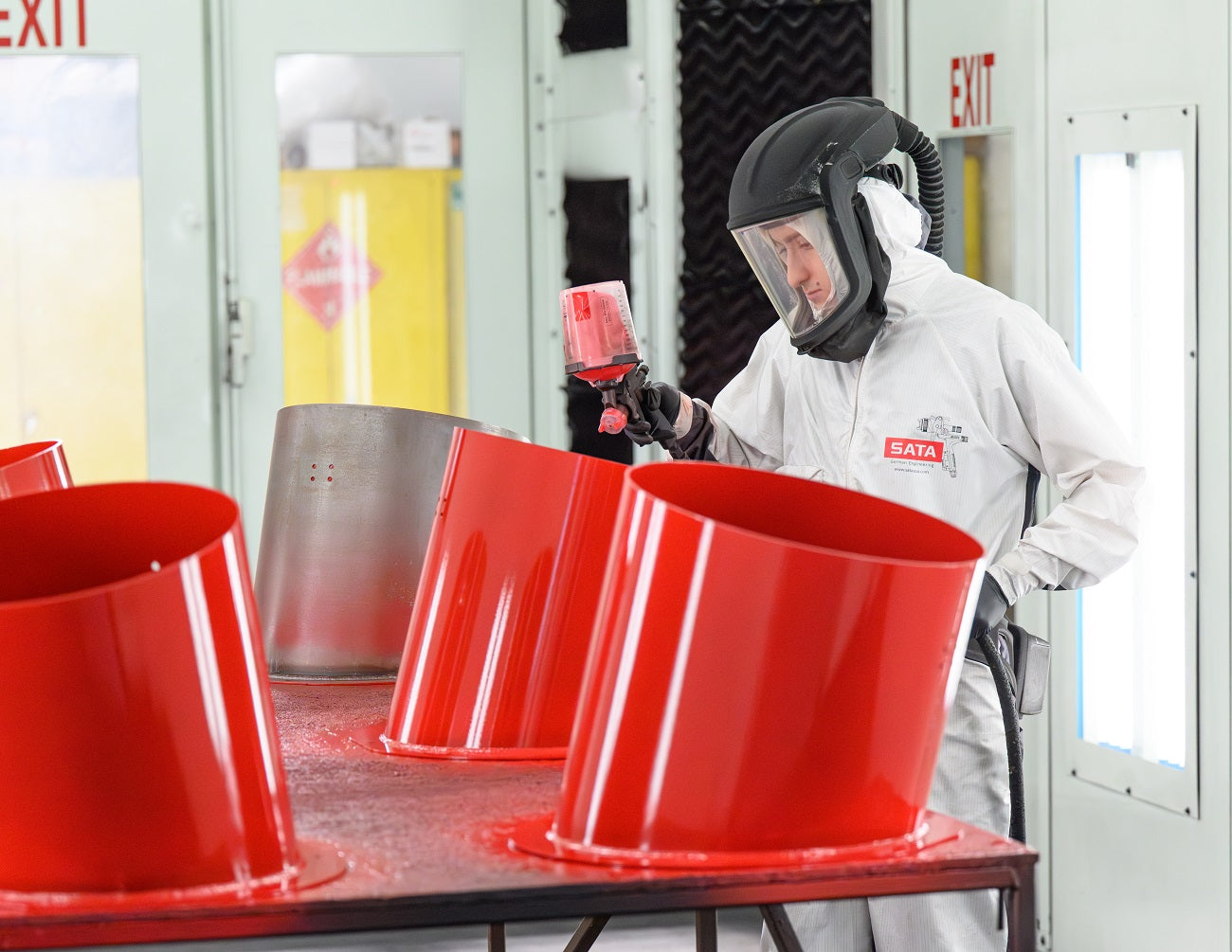 Storch Enamel Painting: Operator Spraying Inside Paint Booth
